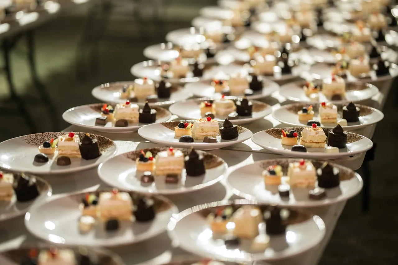 Rows of plated desserts ready for service