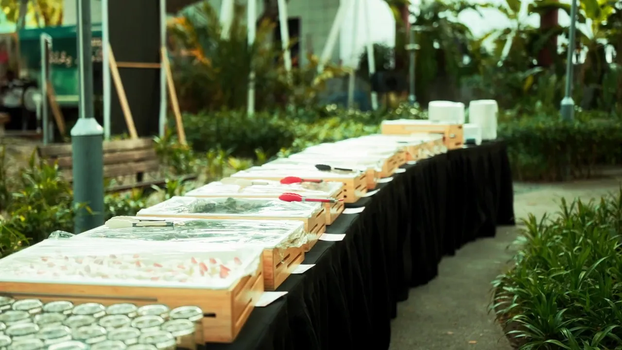 Long buffet table set in a sunlit garden