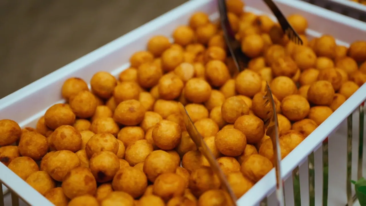 A tray of golden fried short eats